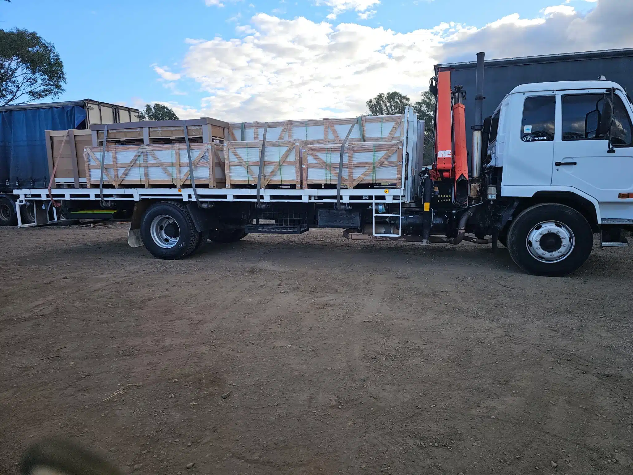 Truck delivering pallets of tiles to a construction site