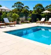 Light outdoor tiles around a swimming pool