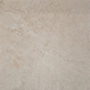Salento Almond warm beige travertine-look tile surface, cropped from the original showroom photograph.